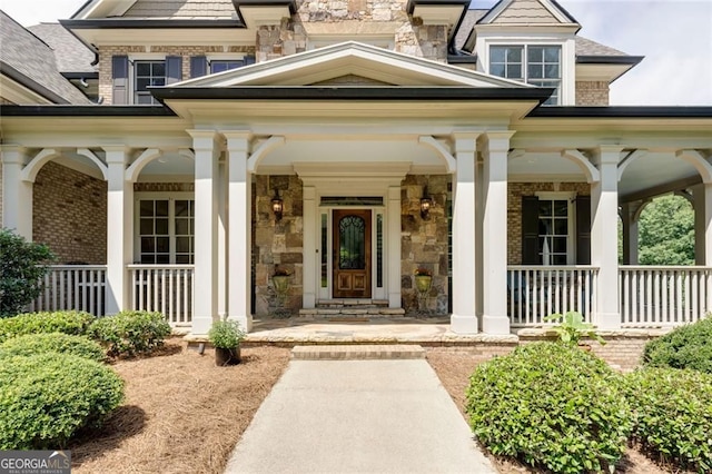 930 Shepards Ct, Roswell, GA 30075 - doorway to property with covered porch, stone siding, and brick siding