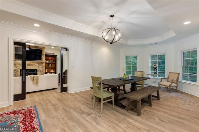 930 Shepards Ct, Roswell, GA 30075 - dining room with ornamental molding, light wood-type flooring, a tray ceiling, plenty of natural light, and a chandelier