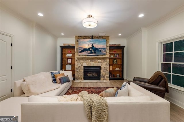 930 Shepards Ct, Roswell, GA 30075 - living area featuring wood finished floors, crown molding, a stone fireplace, and recessed lighting