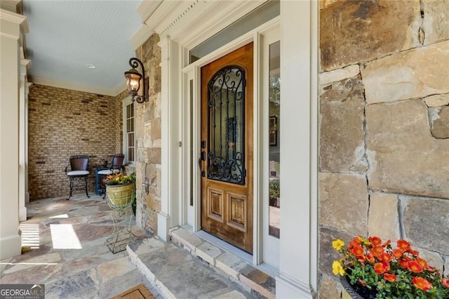 930 Shepards Ct, Roswell, GA 30075 - view of exterior entry with a porch, stone siding, and brick siding