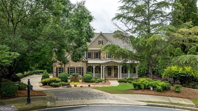 930 Shepards Ct, Roswell, GA 30075 - view of front of property with a porch, driveway, and stone siding