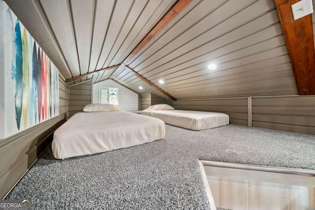 451 Wilderness Camp Rd, White, GA 30184 - bedroom with carpet flooring, wooden walls, and vaulted ceiling