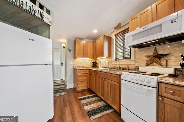 451 Wilderness Camp Rd, White, GA 30184 - kitchen featuring white appliances, dark wood-type flooring, decorative backsplash, recessed lighting, and light stone countertops