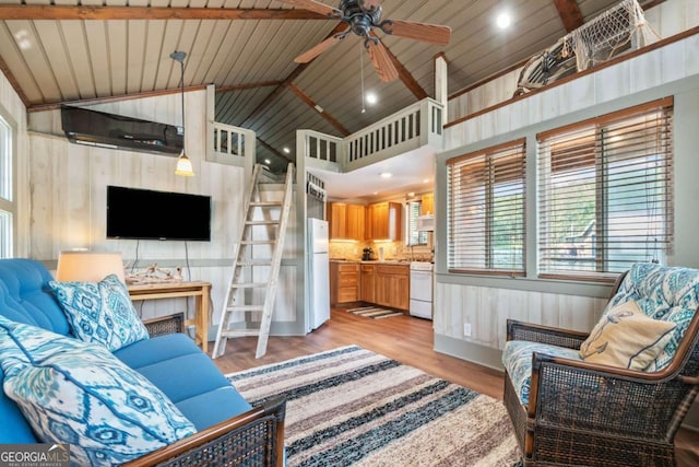 451 Wilderness Camp Rd, White, GA 30184 - living area featuring light wood-type flooring, ceiling fan, healthy amount of natural light, wooden walls, and high vaulted ceiling