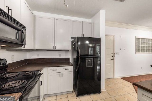 400 17th St NW Unit 2308, Atlanta, GA 30363 - kitchen with black appliances, dark countertops, light tile patterned floors, and crown molding