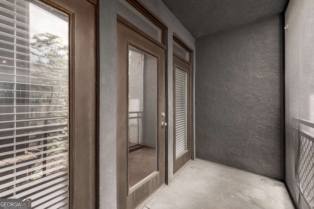 400 17th St NW Unit 2308, Atlanta, GA 30363 - view of exterior entry with stucco siding and a balcony
