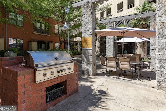 400 17th St NW Unit 2308, Atlanta, GA 30363 - view of patio featuring a grill and outdoor dining area