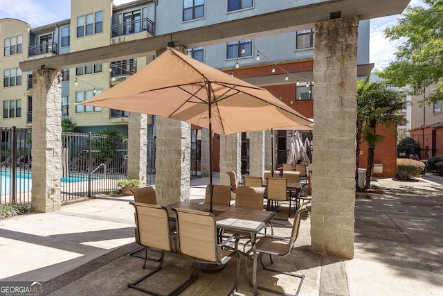400 17th St NW Unit 2308, Atlanta, GA 30363 - view of patio with a community pool and outdoor dining area