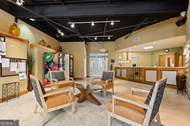400 17th St NW Unit 2308, Atlanta, GA 30363 - tiled living room with track lighting and baseboards