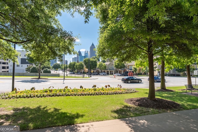 400 17th St NW Unit 2308, Atlanta, GA 30363 - surrounding community with a view of skyline and a lawn