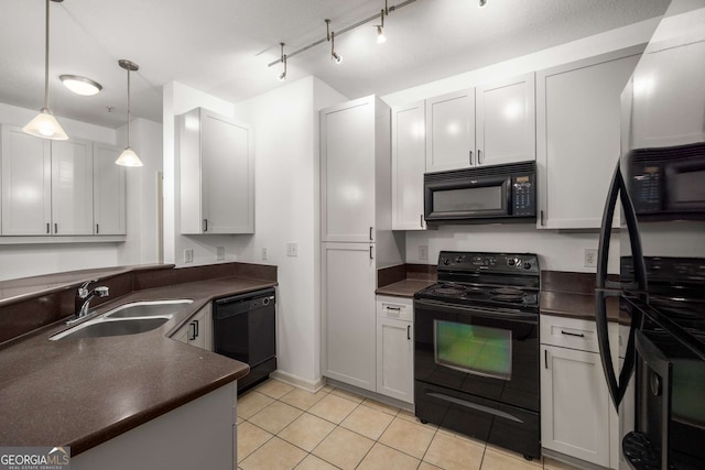 400 17th St NW Unit 2308, Atlanta, GA 30363 - kitchen with black appliances, dark countertops, light tile patterned floors, and hanging light fixtures