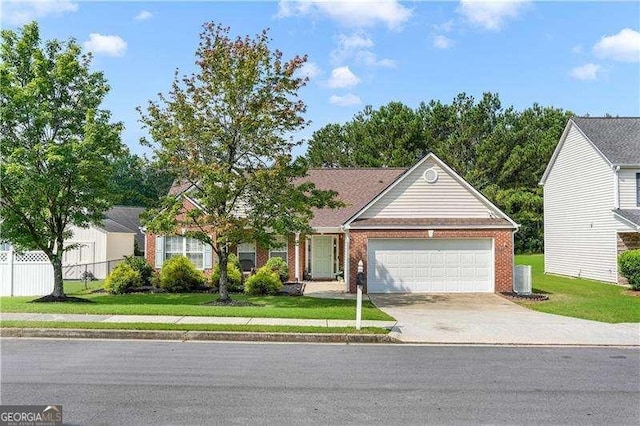 3589 Garden Manor Dr, Loganville, GA 30052 - view of front of property with a garage, concrete driveway, and brick siding