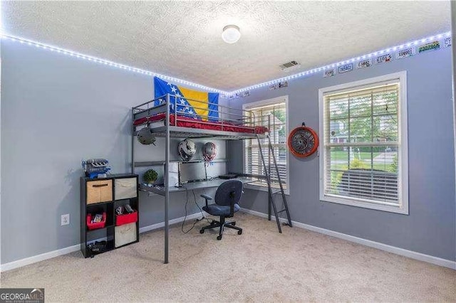 3589 Garden Manor Dr, Loganville, GA 30052 - carpeted bedroom with a textured ceiling and an office area