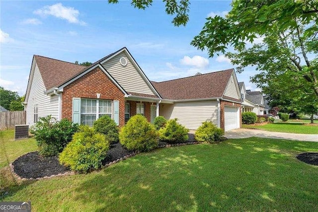 3589 Garden Manor Dr, Loganville, GA 30052 - ranch-style home featuring a garage, brick siding, driveway, and roof with shingles
