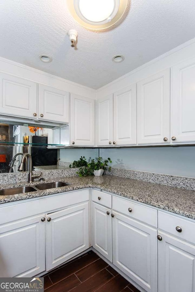 375 Ralph Mcgill Blvd NE Unit 1701, Atlanta, GA 30312 - kitchen with white cabinets, dark wood finished floors, light stone counters, and recessed lighting