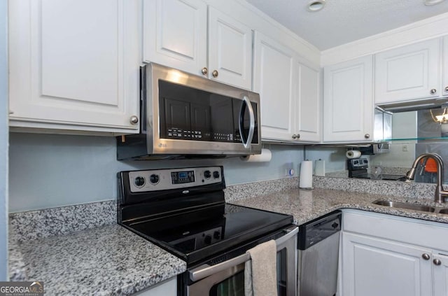 375 Ralph Mcgill Blvd NE Unit 1701, Atlanta, GA 30312 - kitchen featuring stainless steel appliances, white cabinets, and light stone countertops