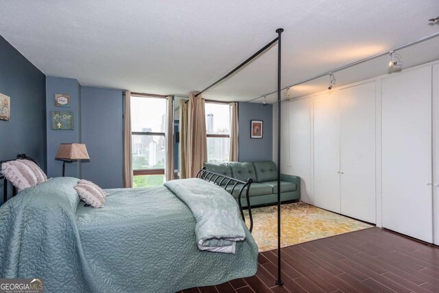 375 Ralph Mcgill Blvd NE Unit 1701, Atlanta, GA 30312 - bedroom featuring track lighting and wood finished floors
