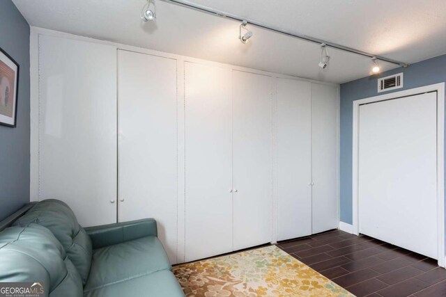 375 Ralph Mcgill Blvd NE Unit 1701, Atlanta, GA 30312 - living room with dark wood-style floors and rail lighting