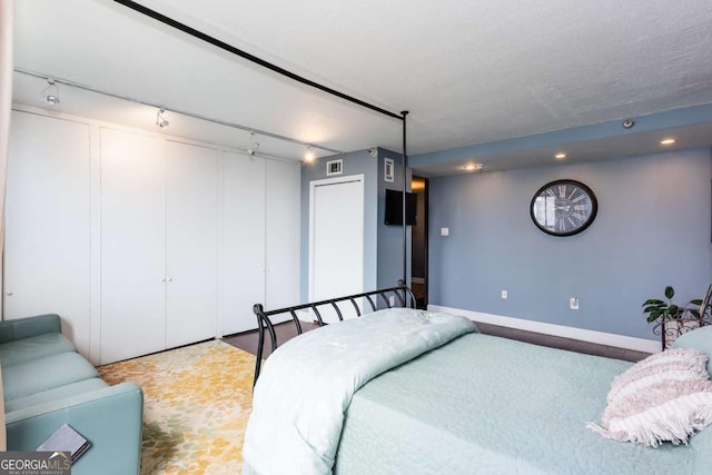 375 Ralph Mcgill Blvd NE Unit 1701, Atlanta, GA 30312 - bedroom with track lighting, a closet, and recessed lighting