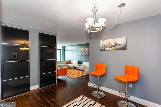 375 Ralph Mcgill Blvd NE Unit 1701, Atlanta, GA 30312 - dining area featuring a chandelier and wood finished floors