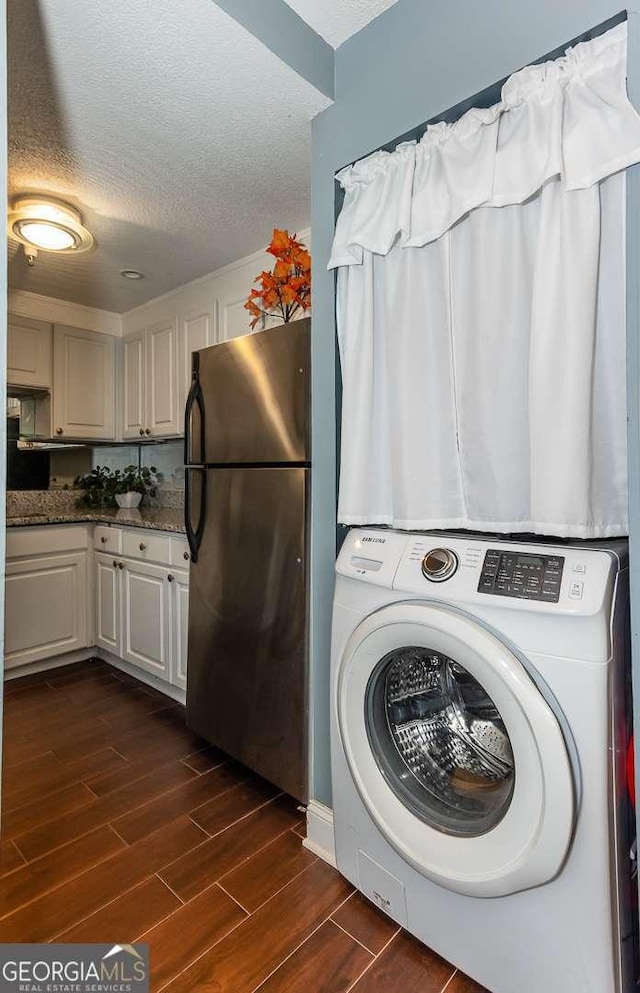 375 Ralph Mcgill Blvd NE Unit 1701, Atlanta, GA 30312 - washroom featuring washer / dryer, dark wood finished floors, and a textured ceiling