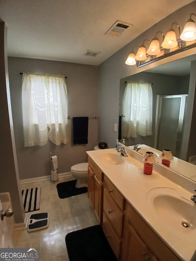 606 Haverhill Cir, Warner Robins, GA 31088 - bathroom with a shower stall and double vanity