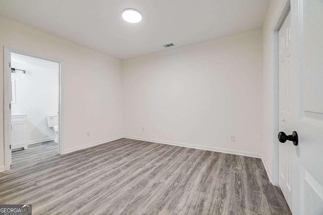 5215 Cordell St, Savannah, GA 31405 - unfurnished bedroom featuring wood finished floors and ensuite bathroom