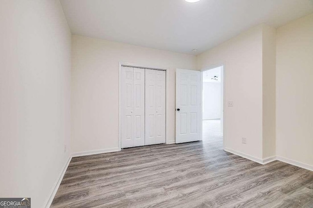 5215 Cordell St, Savannah, GA 31405 - unfurnished bedroom with wood finished floors and a closet
