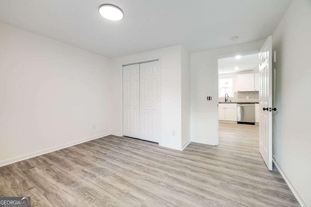 5215 Cordell St, Savannah, GA 31405 - unfurnished bedroom featuring light wood-type flooring and a closet