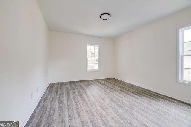 5215 Cordell St, Savannah, GA 31405 - spare room featuring wood finished floors and plenty of natural light