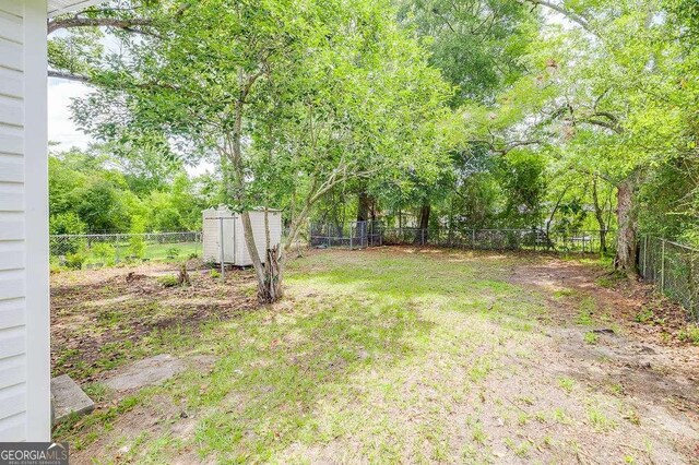 5215 Cordell St, Savannah, GA 31405 - fenced backyard featuring a storage shed