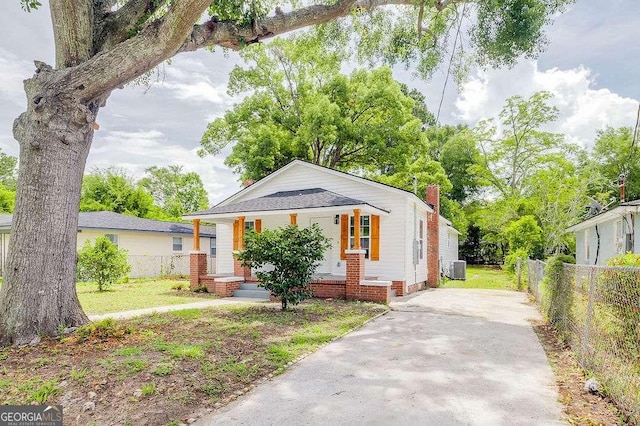 5215 Cordell St, Savannah, GA 31405 - view of front facade with a porch, a chimney, and concrete driveway