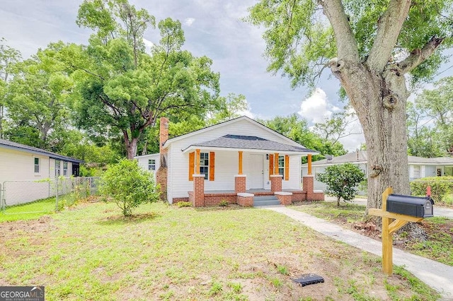 5215 Cordell St, Savannah, GA 31405 - bungalow-style home featuring covered porch and a chimney