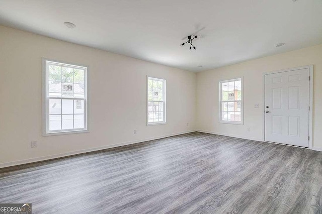 5215 Cordell St, Savannah, GA 31405 - unfurnished living room with wood finished floors and healthy amount of natural light