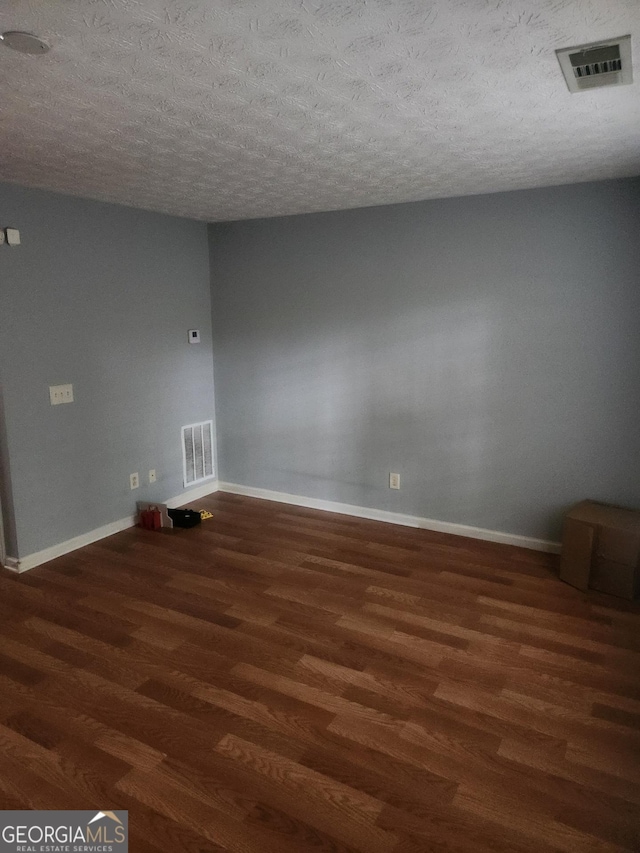 2756 Norfair Loop, Lithonia, GA 30038 - unfurnished room with wood finished floors and a textured ceiling