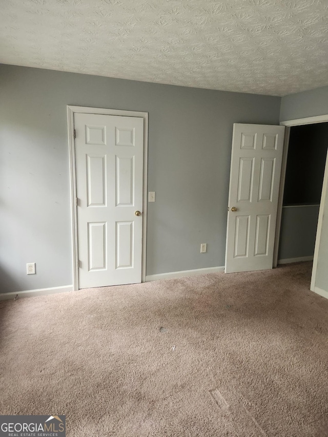 2756 Norfair Loop, Lithonia, GA 30038 - carpeted empty room with a textured ceiling