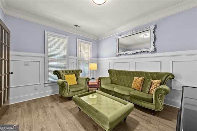 5825 Trailwood Ct, Suwanee, GA 30024 - living room with ornamental molding, wainscoting, a decorative wall, and wood finished floors