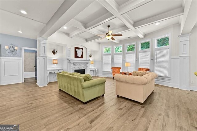 5825 Trailwood Ct, Suwanee, GA 30024 - living area featuring ceiling fan, a fireplace, light wood-style flooring, beam ceiling, and recessed lighting
