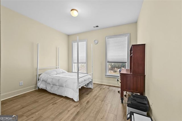 5825 Trailwood Ct, Suwanee, GA 30024 - bedroom with wood finished floors and baseboards