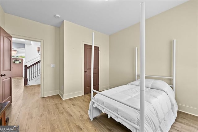 5825 Trailwood Ct, Suwanee, GA 30024 - bedroom with light wood finished floors and baseboards