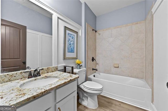5825 Trailwood Ct, Suwanee, GA 30024 - full bathroom featuring vanity, wood finished floors, and shower / bath combination