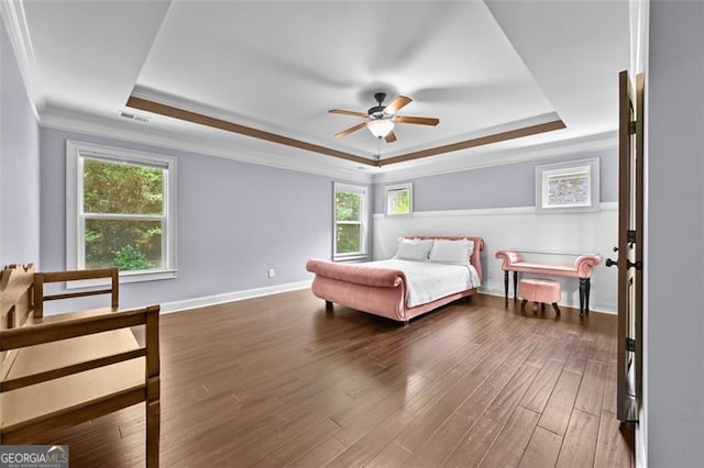 5825 Trailwood Ct, Suwanee, GA 30024 - bedroom featuring a raised ceiling, crown molding, multiple windows, and dark wood-style floors