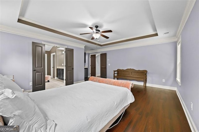 5825 Trailwood Ct, Suwanee, GA 30024 - bedroom featuring a tray ceiling, ornamental molding, wood finished floors, a ceiling fan, and ensuite bath