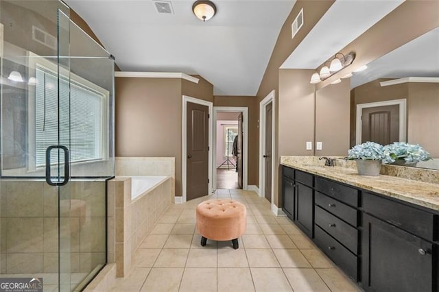 5825 Trailwood Ct, Suwanee, GA 30024 - full bathroom featuring tile patterned flooring, double vanity, a bath, a shower stall, and lofted ceiling