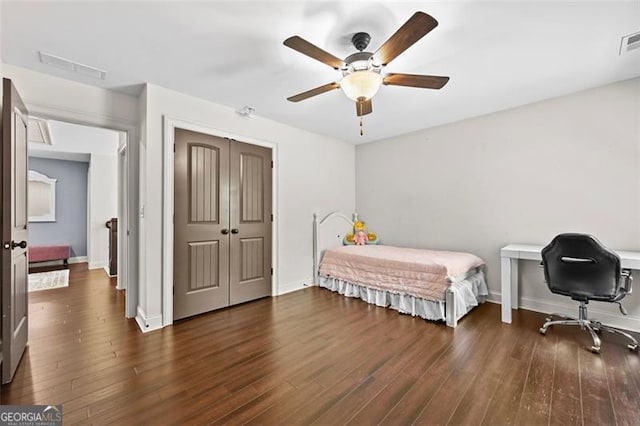 5825 Trailwood Ct, Suwanee, GA 30024 - bedroom with wood finished floors, a closet, and a ceiling fan