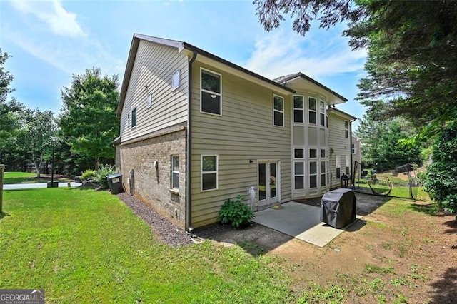 5825 Trailwood Ct, Suwanee, GA 30024 - back of house featuring a yard and a patio