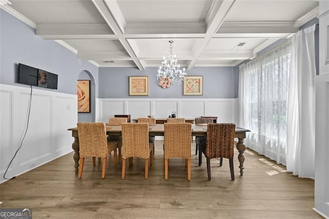 5825 Trailwood Ct, Suwanee, GA 30024 - dining space with a decorative wall, coffered ceiling, beam ceiling, light wood-style floors, and a chandelier