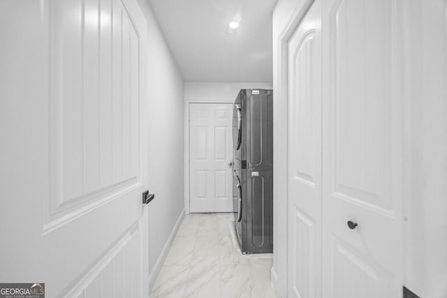 513 Cascade Ct, Hinesville, GA 31313 - hallway featuring stacked washer / dryer, light marble finish floors, and recessed lighting