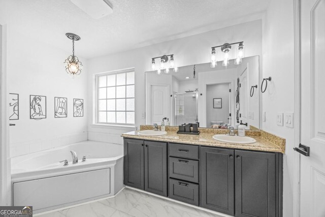 513 Cascade Ct, Hinesville, GA 31313 - bathroom featuring a stall shower, a bath, marble look tile flooring, double vanity, and a textured ceiling
