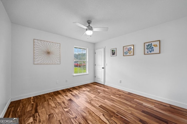513 Cascade Ct, Hinesville, GA 31313 - spare room featuring wood finished floors and a ceiling fan